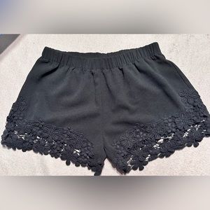 Black, floral bottom dress shorts by LOVE CULTURE